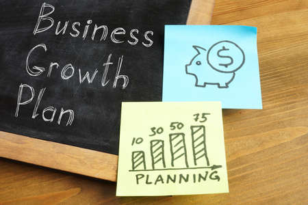 Business growth plan is shown on the photo using the textの写真素材