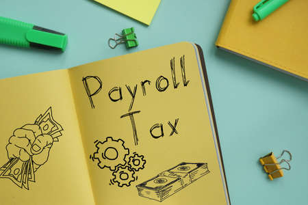Payroll Tax is shown on the business photo using the textの写真素材