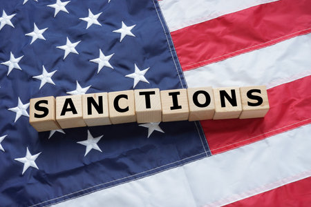 Sanctions are depicted on the cubes that lie on the USA flag