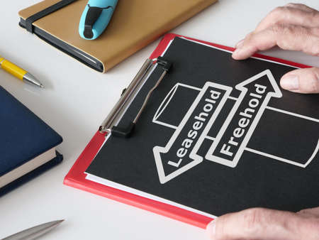 Leasehold vs Freehold is shown on the photo using the text and picture of signpostの写真素材