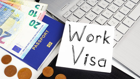 Work visa is shown on a business photo using the text