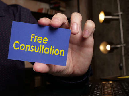 Free consultation is shown using a text on the cardの写真素材