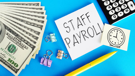Staff payroll is shown using a textの写真素材