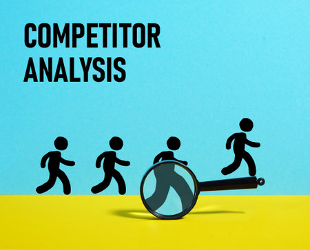 Competitor analysis is shown using a text and photo of magnifying glassの写真素材