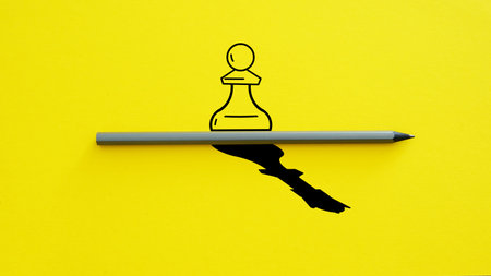 Chess pawn standing in a spotlight that make a shadow of king. Trust yourself, self confident...