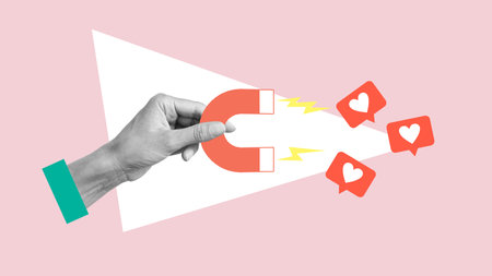 Art collage with female hand holding magnet magnetizing likes symbols isolated over pink background. Concept of social media influence, popularity and digital marketingの写真素材