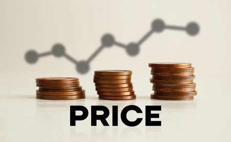 The concept of the word price with coins on a white background with the chart.の写真素材