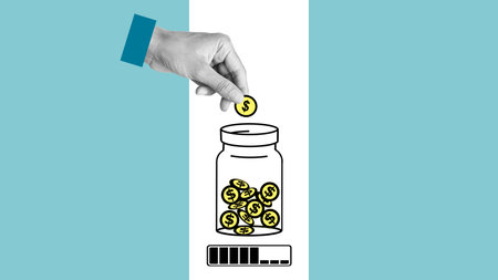 Hand is dropping the coin to the half full jar until it is full. Loan payment. Growth of banking account . Save money and growing of finance and moneyの写真素材