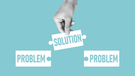 Hand holding a puzzle with the word solution. There is a matching puzzle next to it with the word problem. All problems can be solved. Problem solutionの写真素材