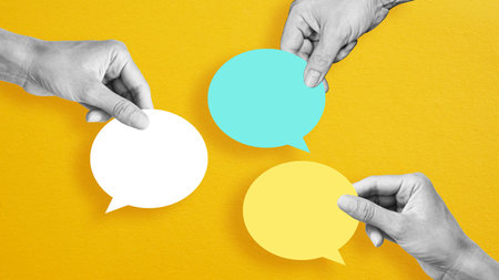 Business communication breakdown concept. Lack of communication skills. Businessmen drawing speech balloons. Hands with speech balloonsの写真素材