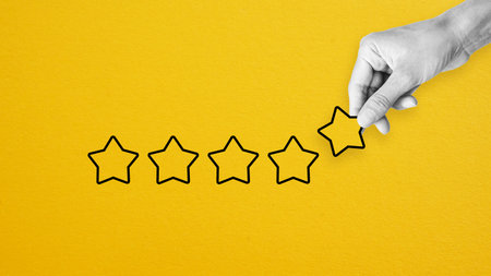 Reputation management. Customer Experience Concept. Woman hand puts five star excellent rating, copy space.の写真素材