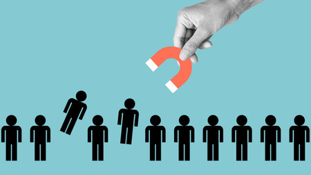Employee selection or attracting new customers or followers. Magnet pulls employees out of row. Recruitment and human resources managementの写真素材