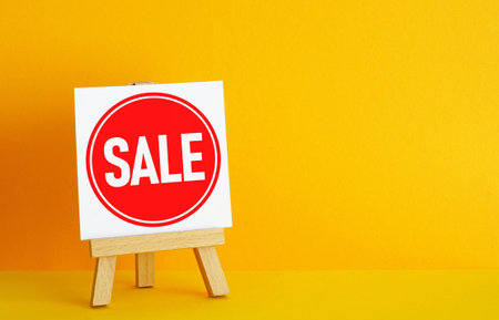 Shopping discount and promotion announcement. Banner with the word sale on yellow background with copy spaceの写真素材