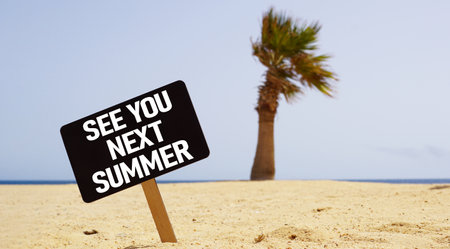See you next Summer is shown using a text on the board on the sea beachの写真素材