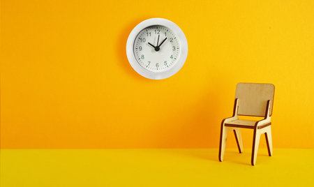 Waiting time, procrastination, delay and urgency concept. Chair for waiting and clock on the orange wall. Empty space for textの写真素材
