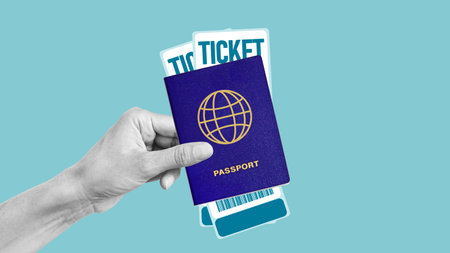 Travel and tourism concept. Hand holding passport and airline tickets. Travel tips. Empty space for textの写真素材