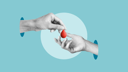 Blood transfusion and Blood donor concept. The hand puts drop to other hand as donationの写真素材
