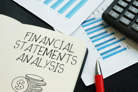 Financial statements analysis is shown using a text as business conceptの写真素材