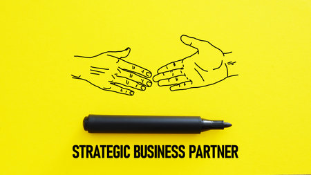 Strategic business partner is shown using a text and picture of handshakeの写真素材