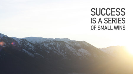 Success is a series of small wins - motivation quote is shown using a textの写真素材