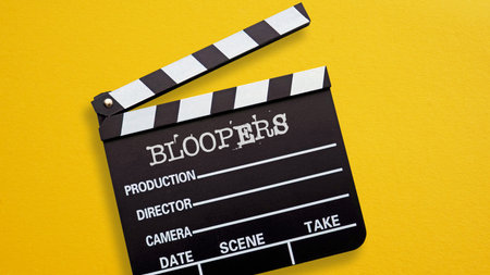 Bloopers are shown using a text on the open film slate as outtakes mistakes wrong flubsの写真素材