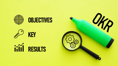 OKR Objectives and Key Results as Business Strategy Concept with target, gears, charts and strategic planning, performance trackingの写真素材