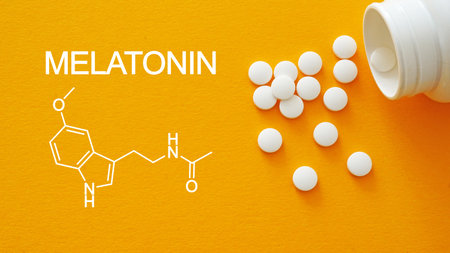 Melatonin is shown using a text and photo of pills. Sleep hormoneの写真素材