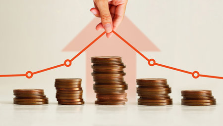 Financial Growth and Decline Concept. Investment Performance Chart Over Coin Stacks Showing Rise and...