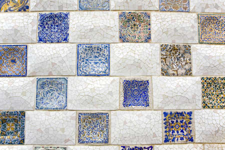 Wall of tiling in Park Guell of Antoni Gaudiの写真素材