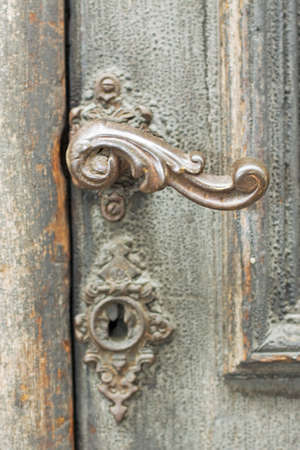 Old handle, the wooden doorの写真素材