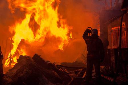 Firemen extinguish a house and building; 