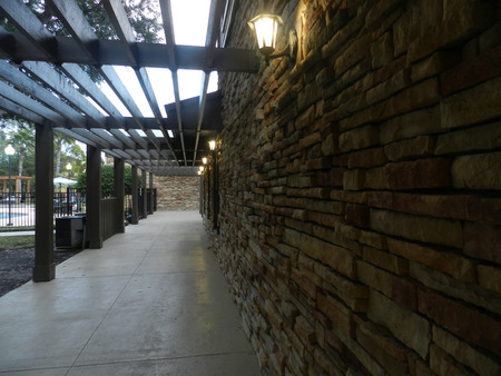 Brick wall with wood. Entry to luxury modern villa garden - Modern constructionのeditorial素材