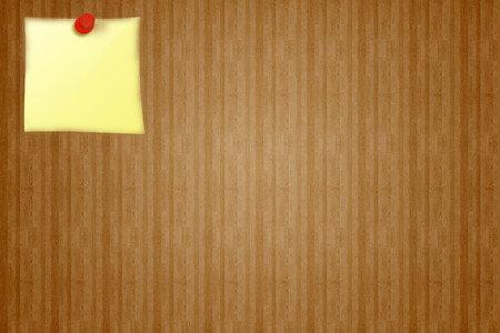 Yellow sticker on a wooden brown board background from notice. Free space for your design and tools.の写真素材