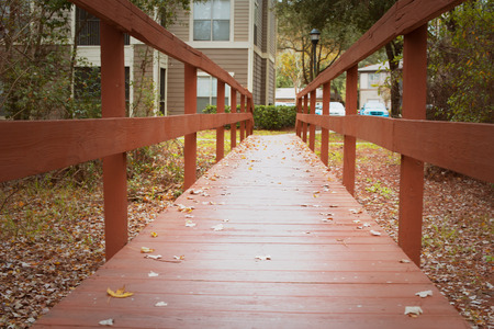 Red wooden bridge at autumnの写真素材