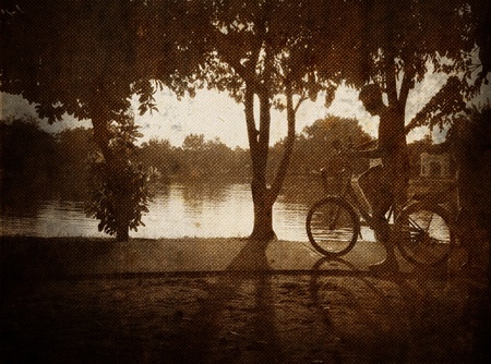 Father and son riding a bike  の写真素材