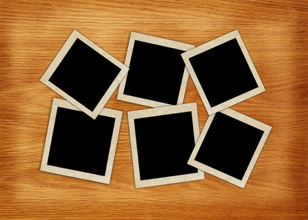 photo frames on wood background の写真素材