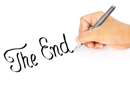 Hand writes the word endの写真素材