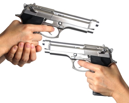 Woman's hand with a gun. Isolated on white.の写真素材