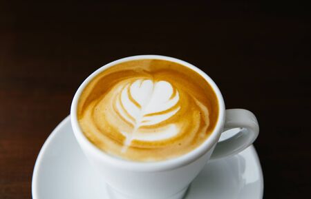 Latte art. Barista coffee cupの写真素材