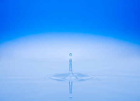 water splash on blue backgroundの写真素材
