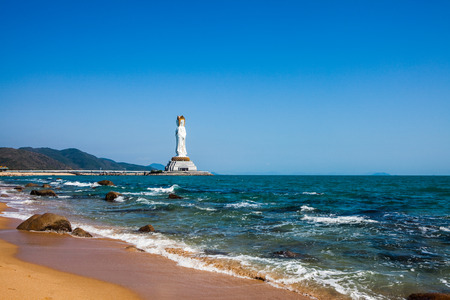 Sanya beach with Guanyin statue.の写真素材