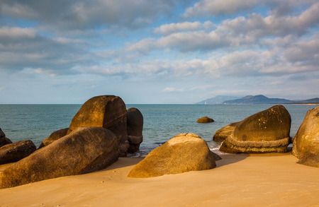 Sanya beach with rockの写真素材