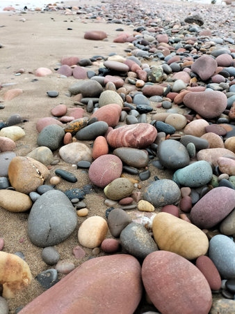 Colorful stones on the beach, closeup of photo, soft focus
