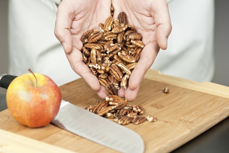 Close-up of a chef displaying pecans.の写真素材
