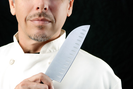 Close-up of a chef displaying his knife.の写真素材