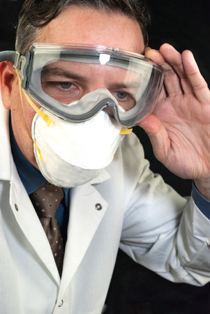 Close-up of a Doctor wearing a mask and goggles の写真素材