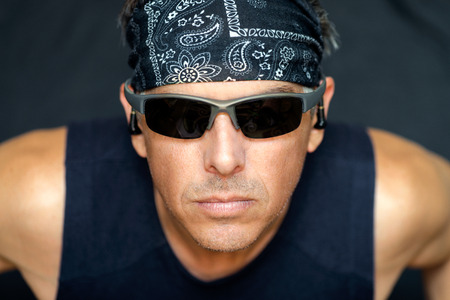 Close-up of intense athletic man looking to camera.の写真素材