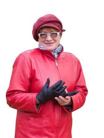 Smiling old lady in red holds a black gloveの写真素材