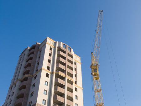 crane on construction of building new houseの写真素材