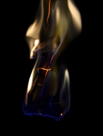 Burning paper letter "z" over black backgroundの写真素材